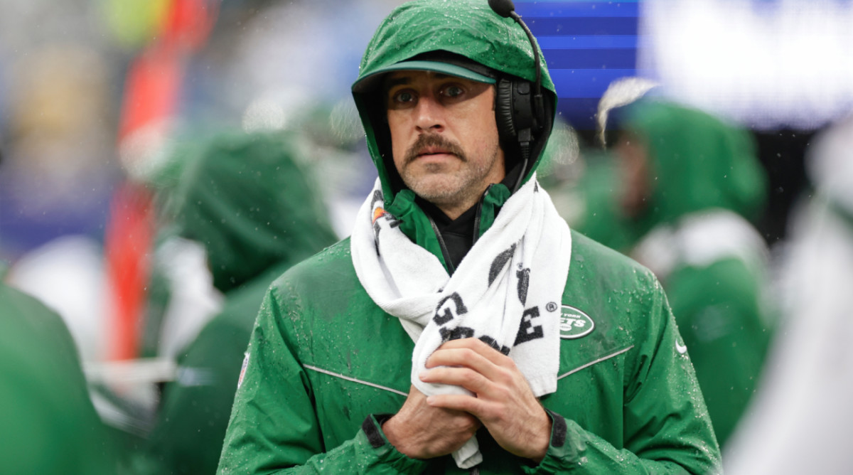 New York Jets quarterback Aaron Rodgers (8) works the sidelines during the first half of an NFL football game against the New York Giants, Sunday, Oct. 29, 2023, in East Rutherford, N.J. (AP Photo/Adam Hunger)   